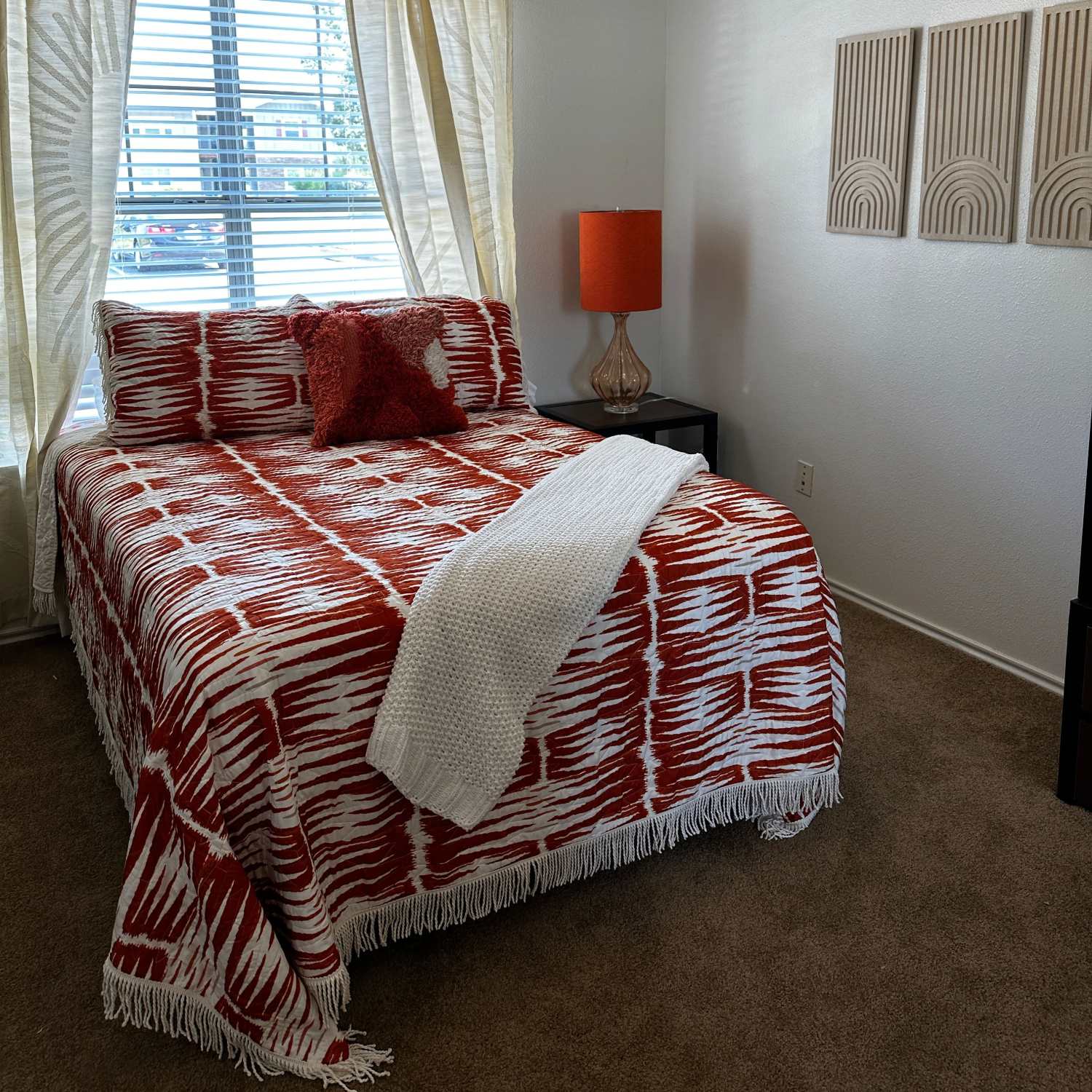 Carpeted bedroom at The Quarters at Lawrence in Lawrence, Kansas