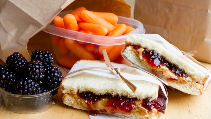 Delicious peanut butter and jelly sandwich with a side of carrots and blackberries at The Hawthorne