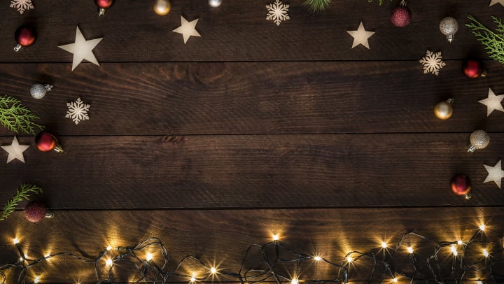 Christmas decorations around a wooden plank