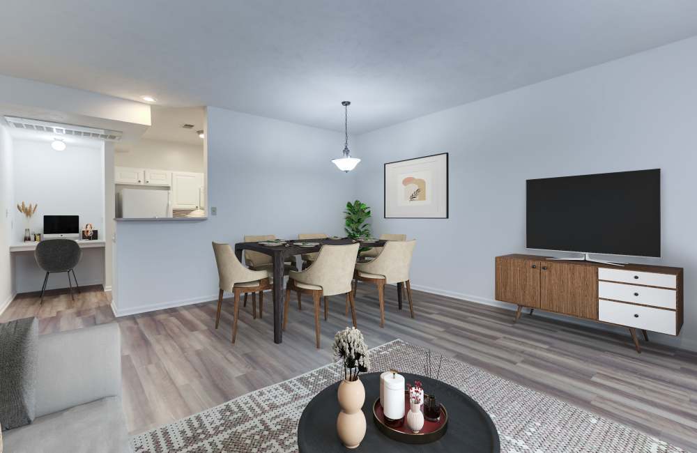 Living room with hardwood style flooring at Hills of Aberdeen Apartment Homes in Valparaiso, Indiana