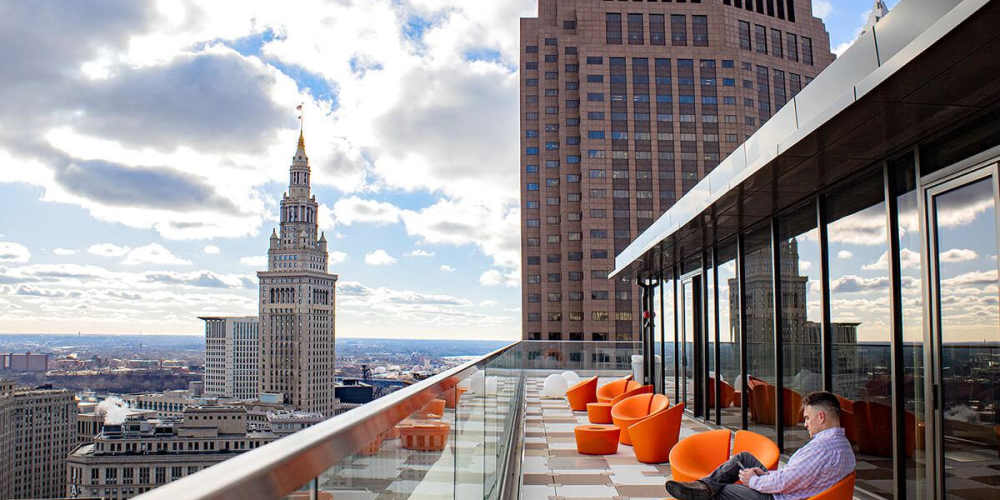 Rooftop seating with a view of the city around The Beacon in Cleveland, Ohio