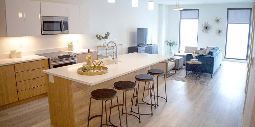 An apartment kitchen with an island at The Beacon in Cleveland, Ohio