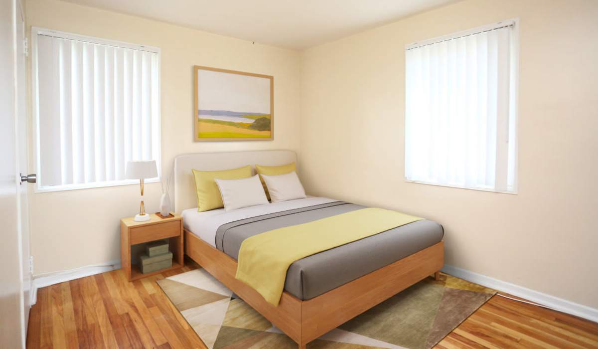 Spacious bedroom with large comfortable bed at Central Park in Park Forest, Illinois 