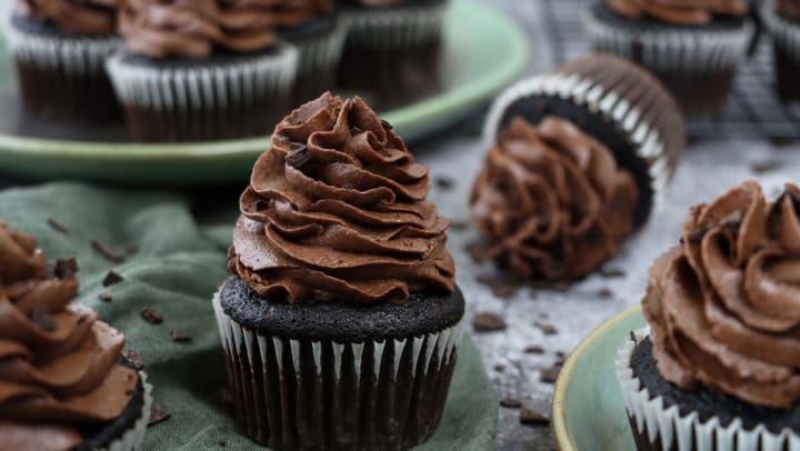 Close-up of a dark chocolate cupcake with chocolate buttercream on top