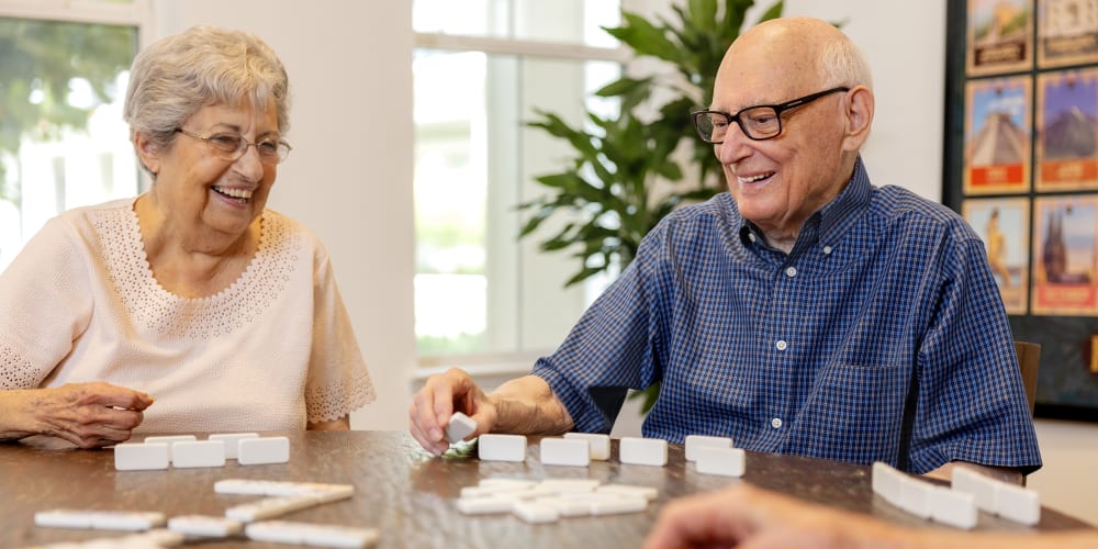 Residents playing dominoes at The Barclay at Santa Rosa Beach in Santa Rosa Beach, Florida