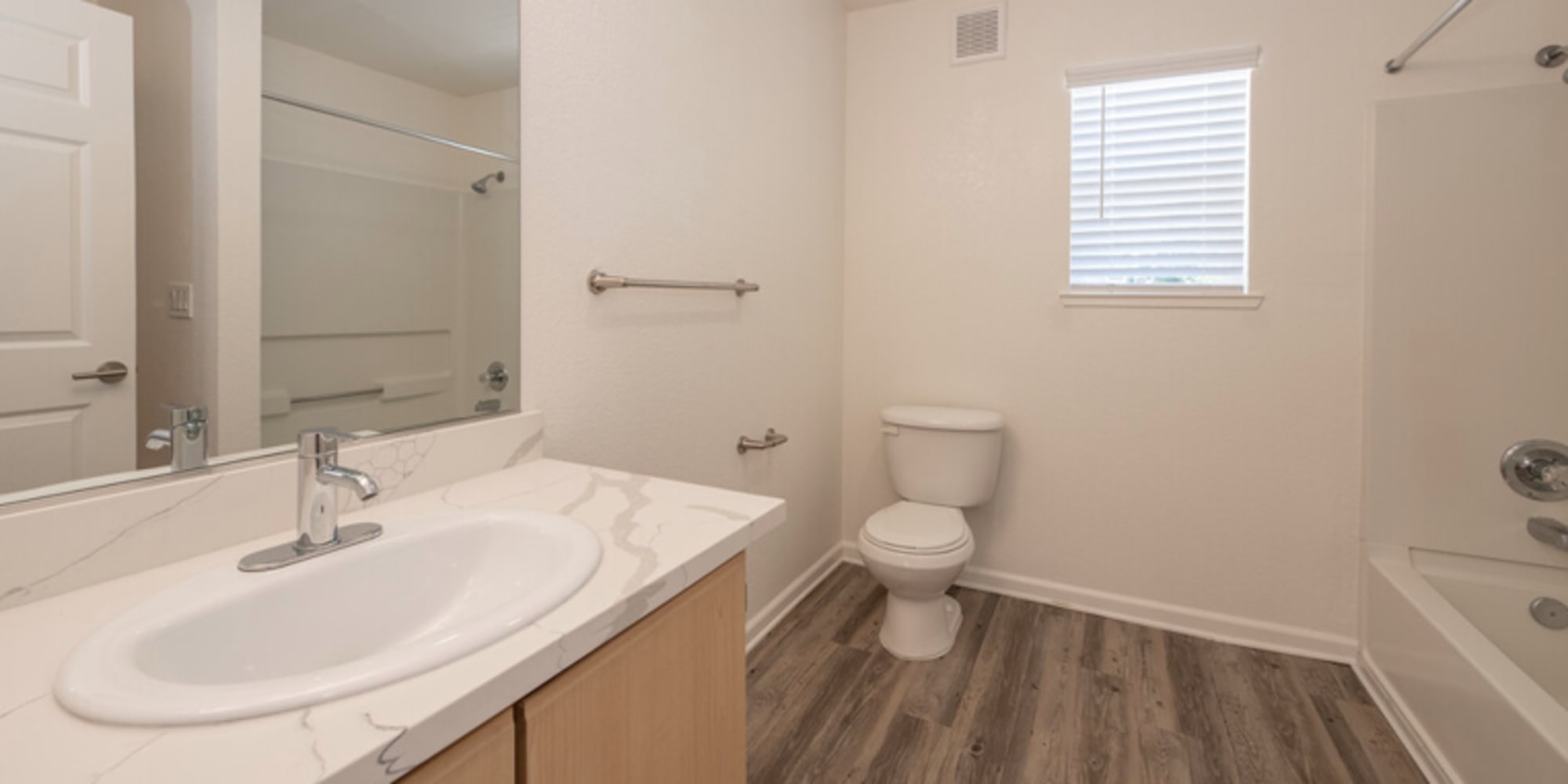 Bathroom with wood-style flooring at Granite Creek in Rocklin, California