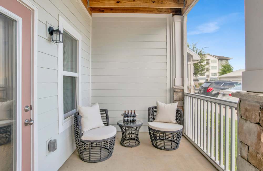 Beautifully finished hardwood flooring in a model apartment's living area at The Crossings At Milestone in Pensacola, Florida