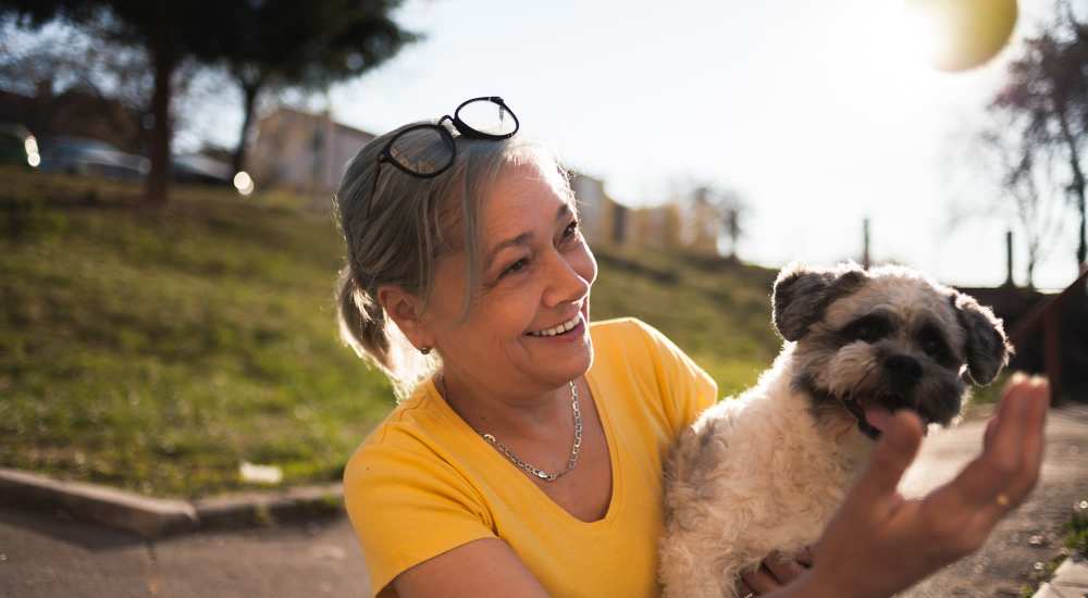 Resident playing with her furry friend near Aztec Pacific in San Diego, California