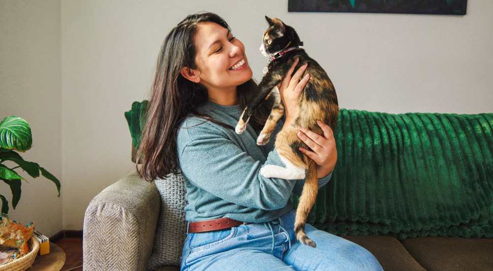 Resident with their pet cat at Regency in Sherman Oaks, California