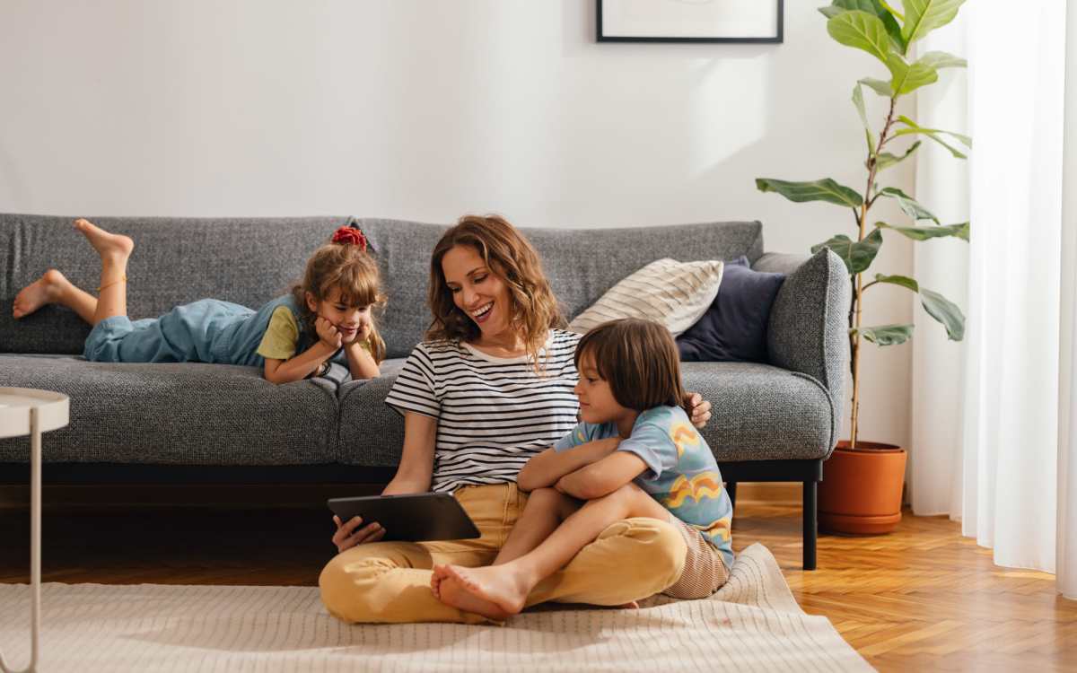 Happy resident with her kids at Trio Terraza in El Paso, Texas