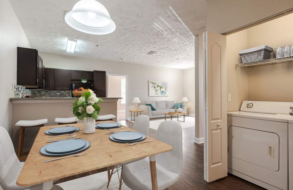 dining area next to in-unit laundry closet