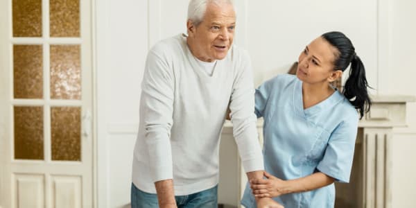 Resident receiving assistance in their home at Bell Tower Residence Assisted Living in Merrill, Wisconsin