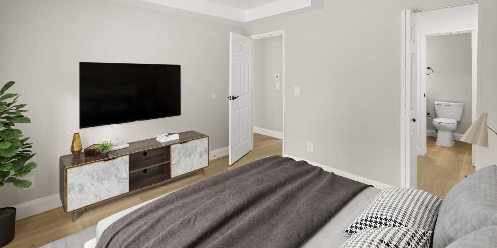 Cozy bedroom with modern decor and spacious layout at The Grove in Battle Creek, Michigan