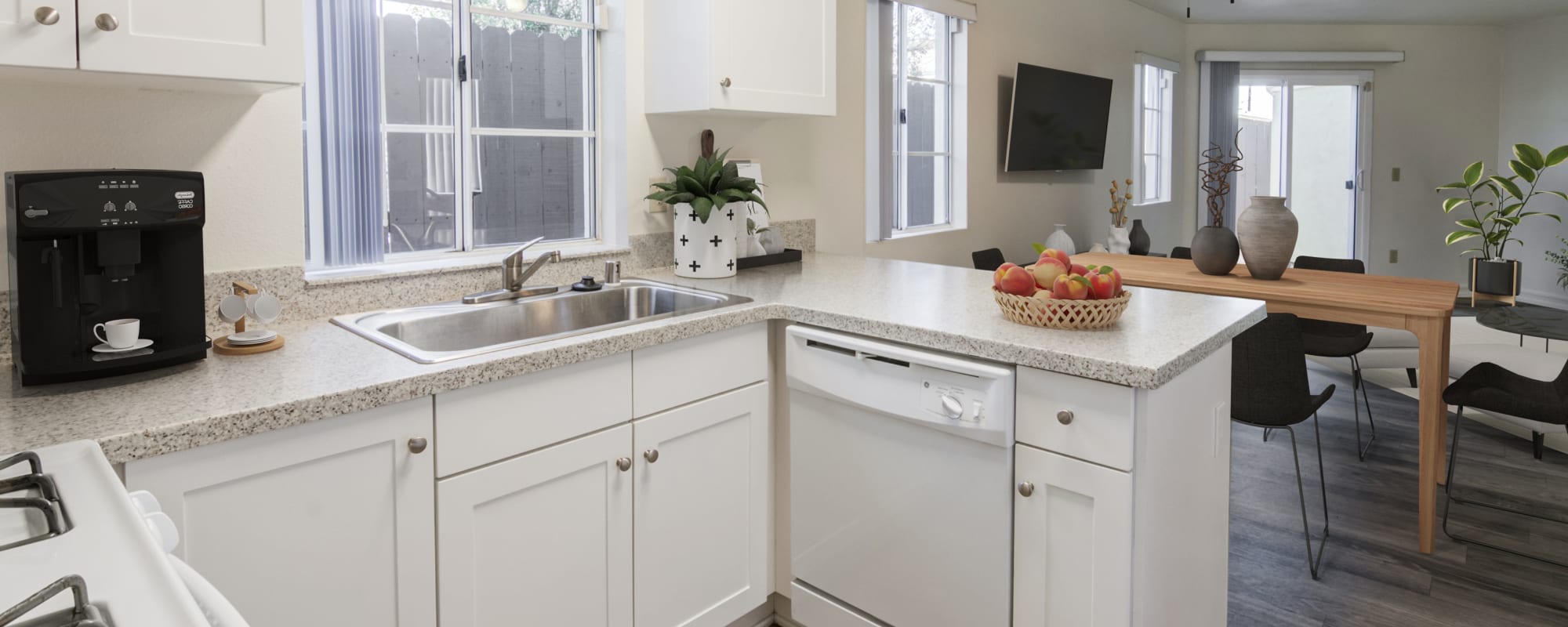 Kitchen with white appliances and white cabinets