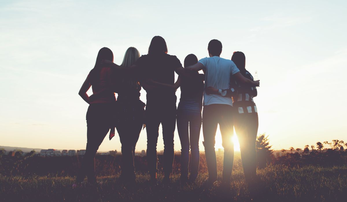 A group of friends looking out at the sunset near Seaton Preserve in Jacksonville, Florida