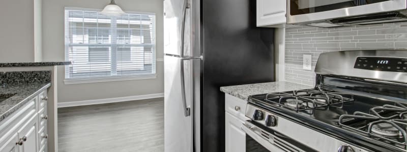 Kitchen with stainless steel appliances at Bradlee Danvers in Danvers, Massachusetts