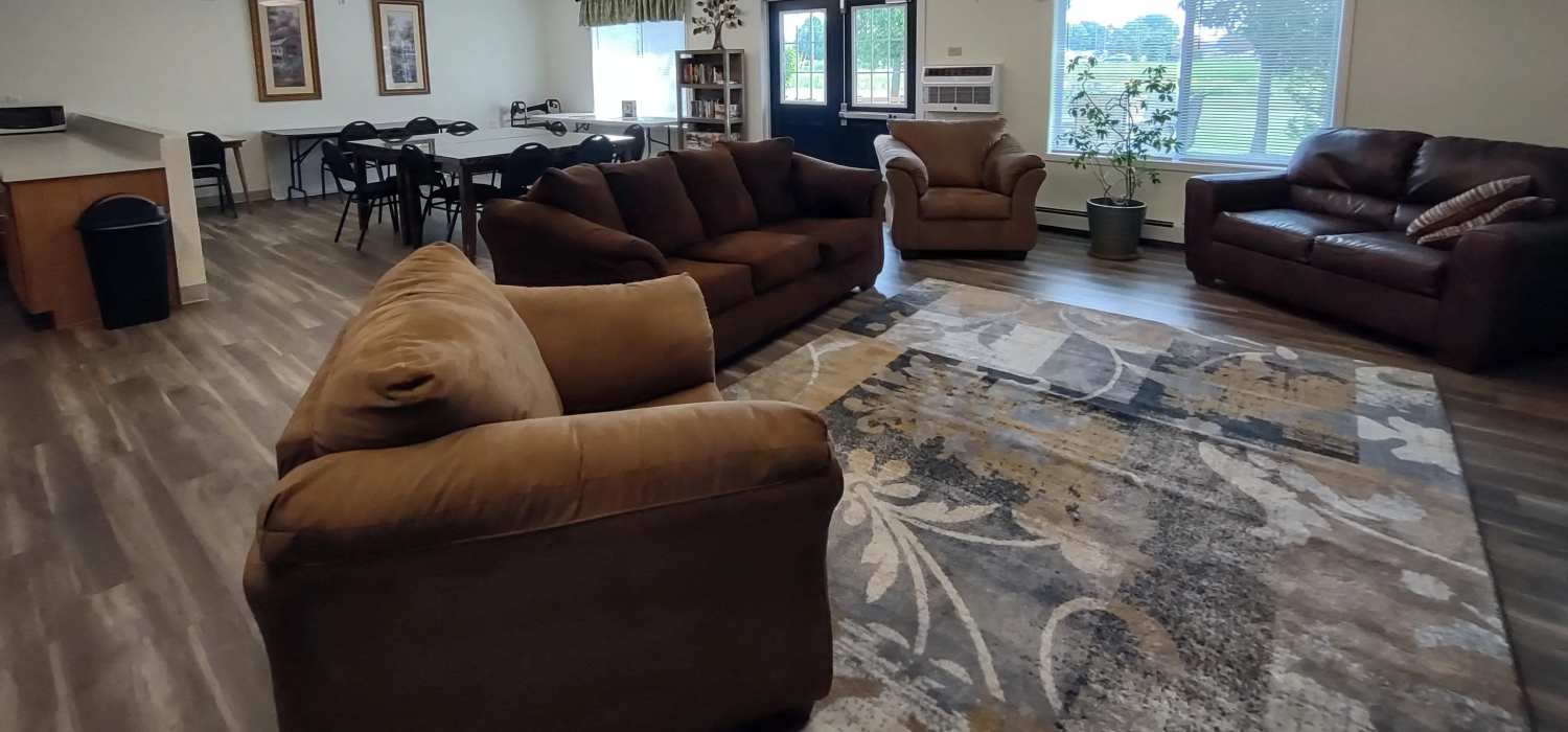 Clubhouse seating area at Willow Creek Apartments in Escanaba, Michigan