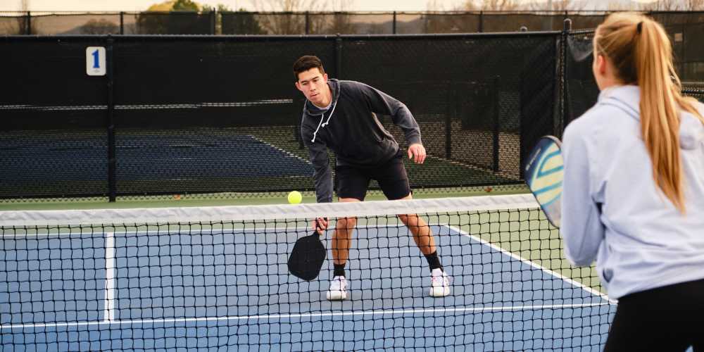Residents playing pickleball at BB Living Seven Shores in Naples, Florida