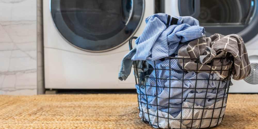 Community laundry room with washer and dryer at Central West End Apartments in Saint Louis, Missouri