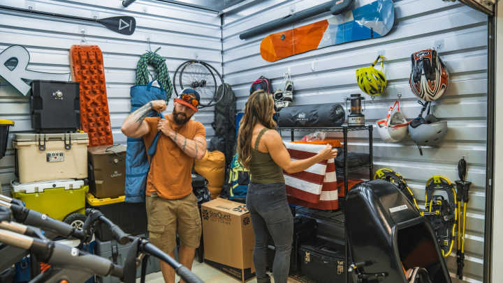 Storage users folding American flag while in unit full of gear