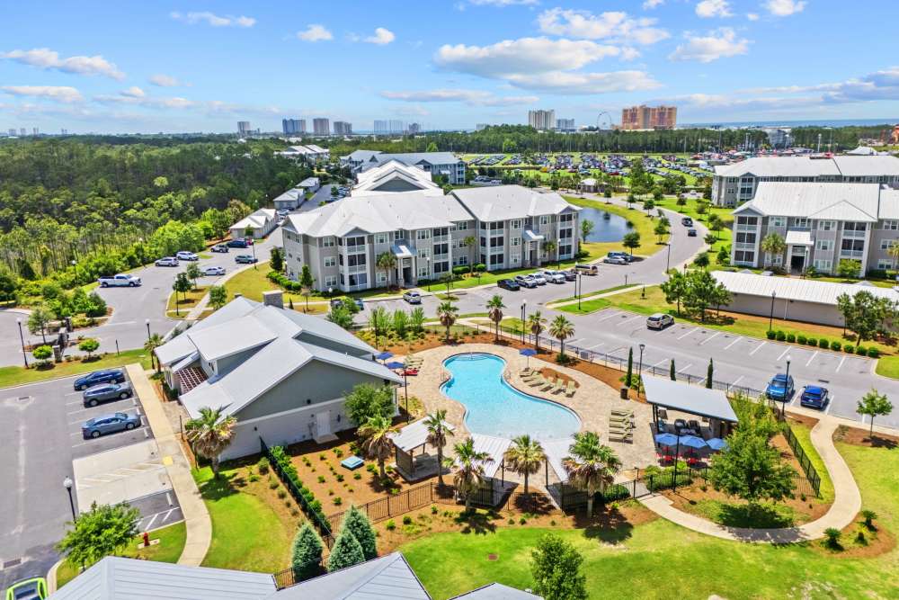 Clubhouse and pool aerial view of apartments located in Panama City Beach.
