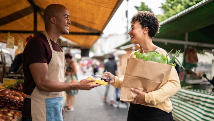 shopper and vendor at a farmers
