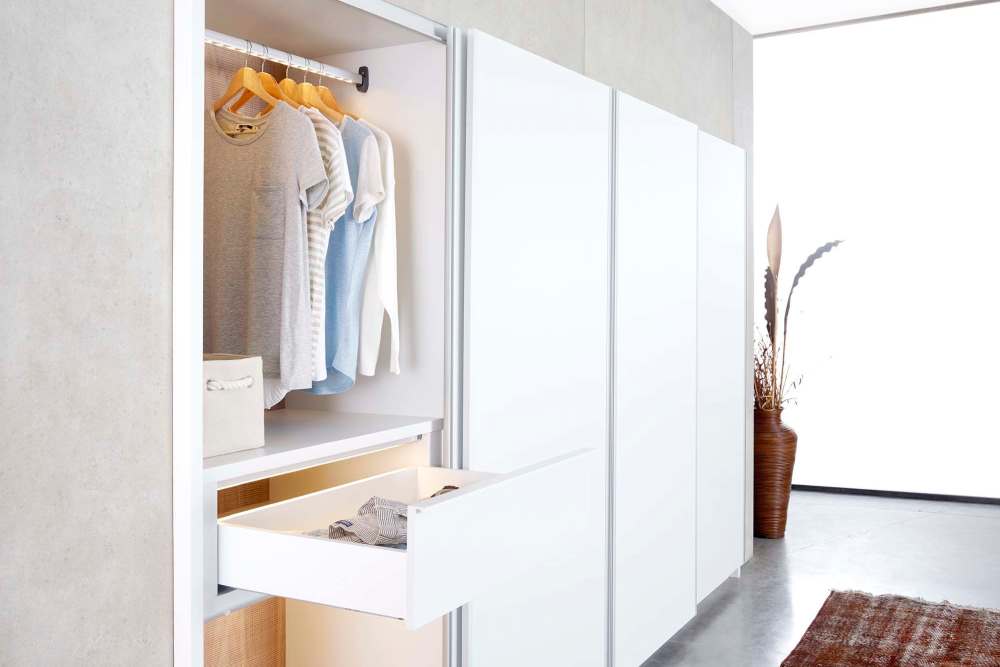 View of large walk-in closet at Athens Vista Senior Apartments in Los Angeles, California