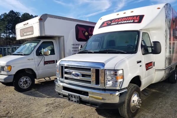 Moving trucks with logo from Cardinal Self Storage - North Durham in Durham, North Carolina