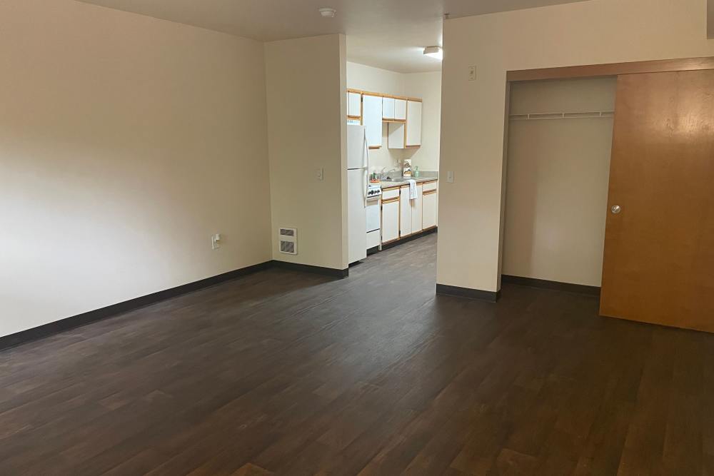 Living room with wood-style flooring at The Yards At Union Station in Portland, Oregon