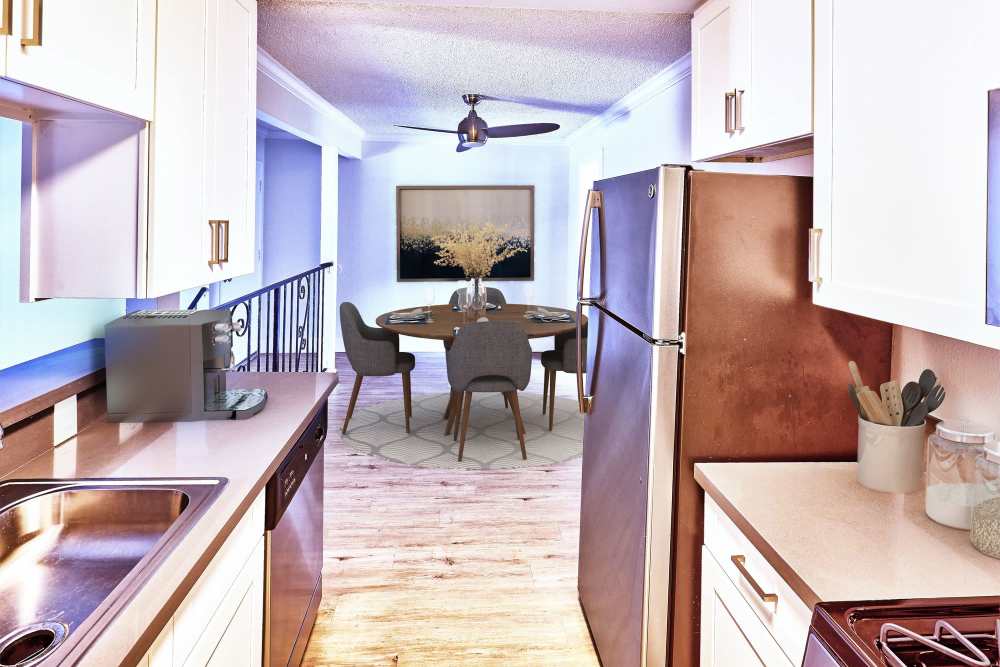 Morden kitchen with stainless steel appliances at Windwood Apartments in West Covina, California