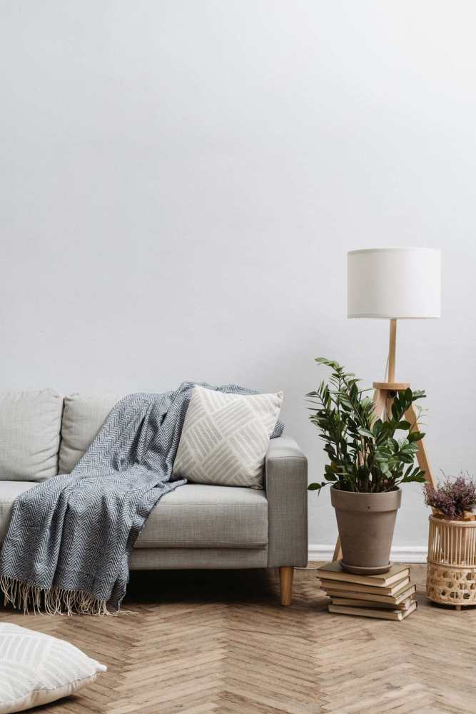 Living room with couch at El Patio Apartments in Laredo, Texas