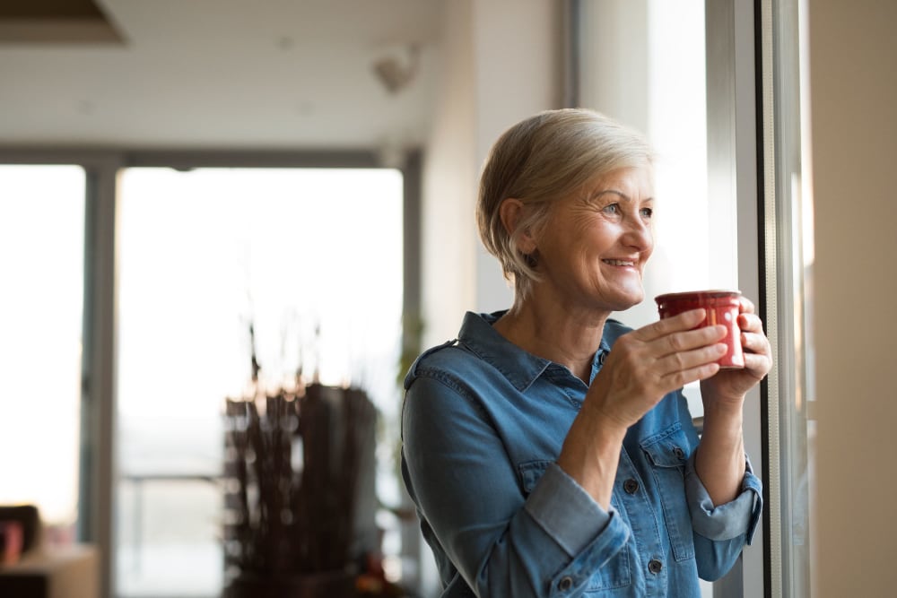 Resident sipping her coffee in her home at Sandpiper Apartments in Seatac, Washington