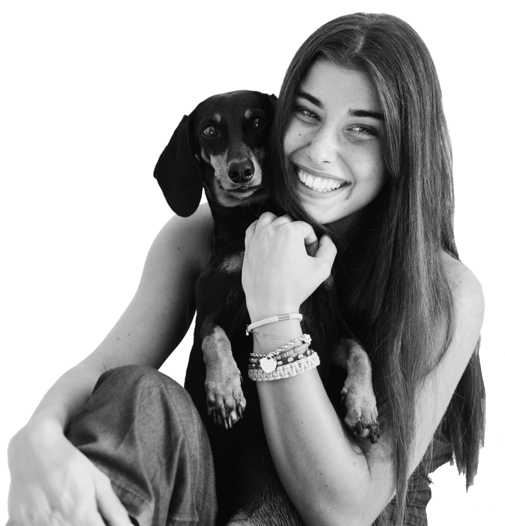 A smiling woman with her dog at Integra Heights in Clermont, Florida