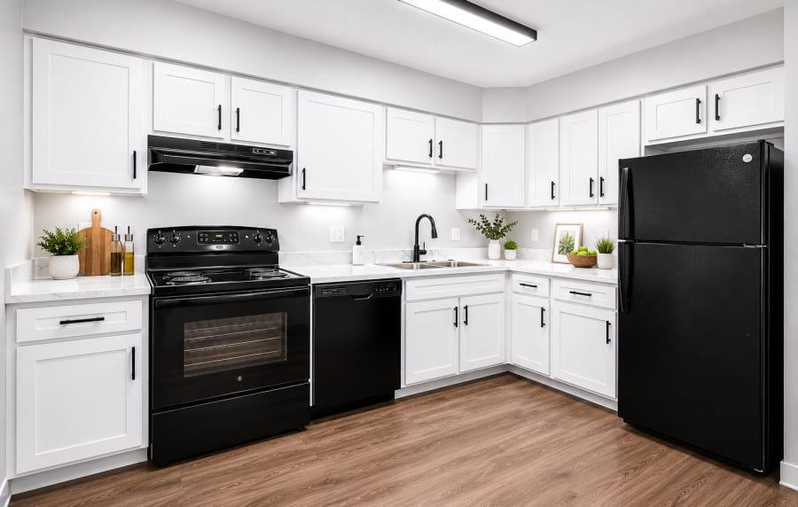 Kitchen showing black appliances at Park @ Nine23 in Cedar Falls, Iowa