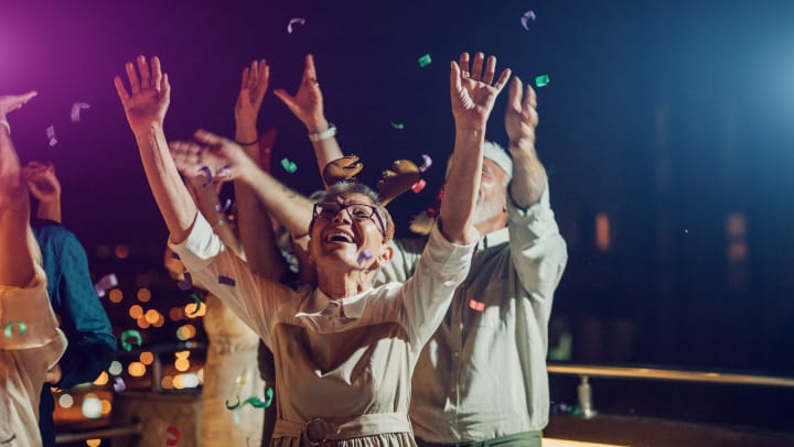 Group of senior friends having New Year’s Eve party