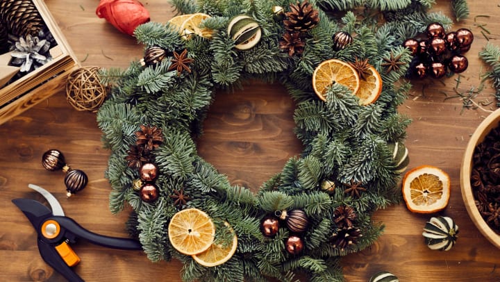Wreath creation with dried fruits on a craft table