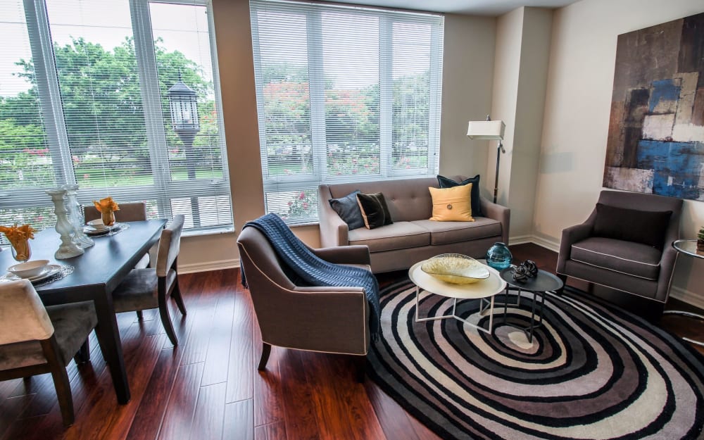 Spacious living room with a large window in a model home at Midtown 24 in Plantation, Florida