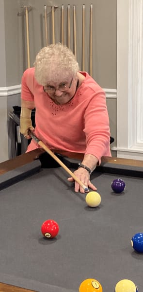 Glen Mills (PA) resident takes a shot on the pool table.