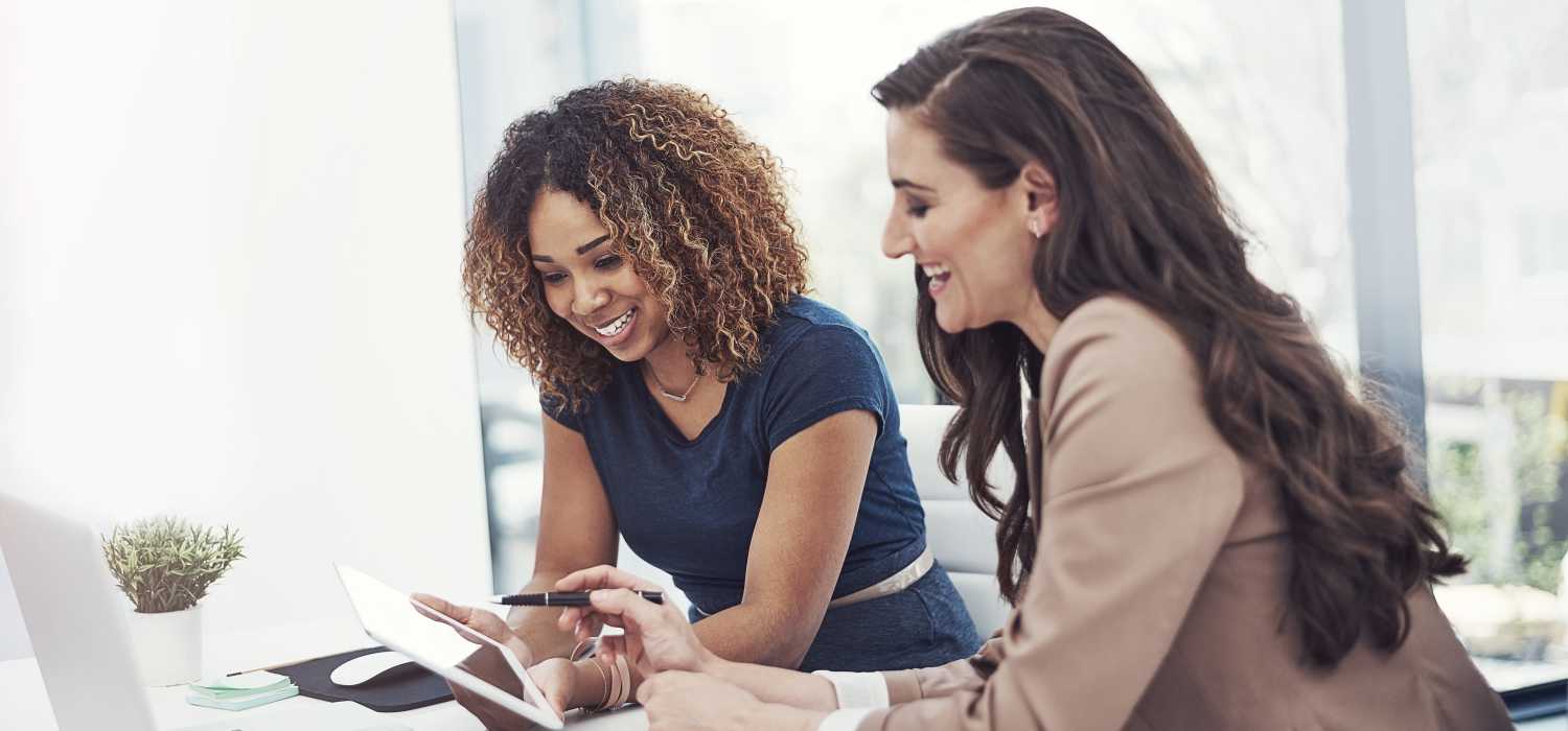 Women checking for online rental payments at Birch and Branch Apartments in Raleigh, North Carolina
