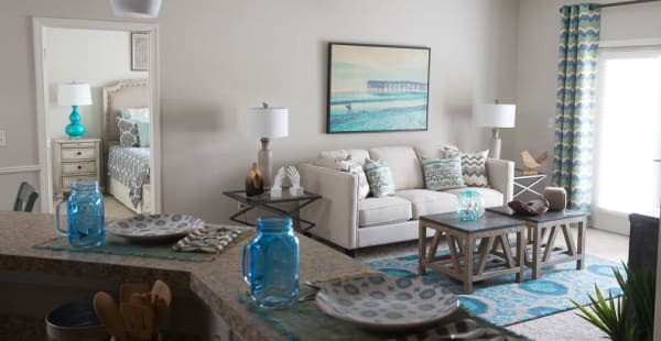 Kitchen with a breakfast overlooking the living room in a model apartment home at Ansley Commons Apartment Homes in Ladson, South Carolina
