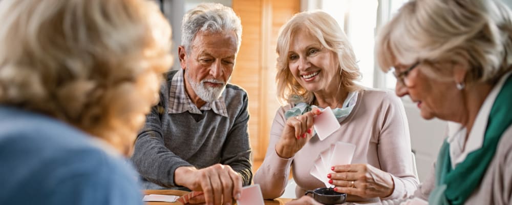 Residents playing cards at Ridgeline Management Company in Rockwall, Texas