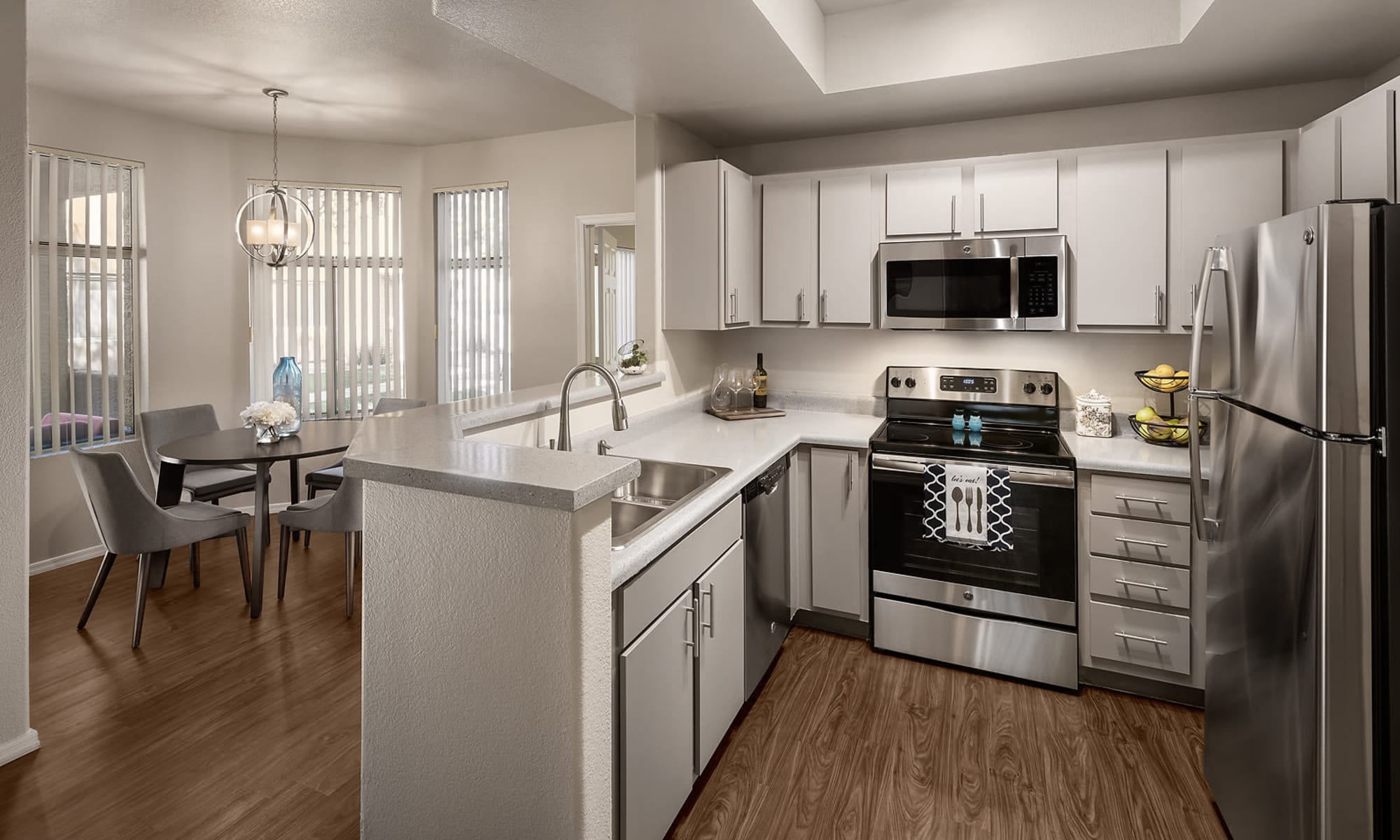 Kitchen and dining area at Bellagio | Apartments in Scottsdale, Arizona