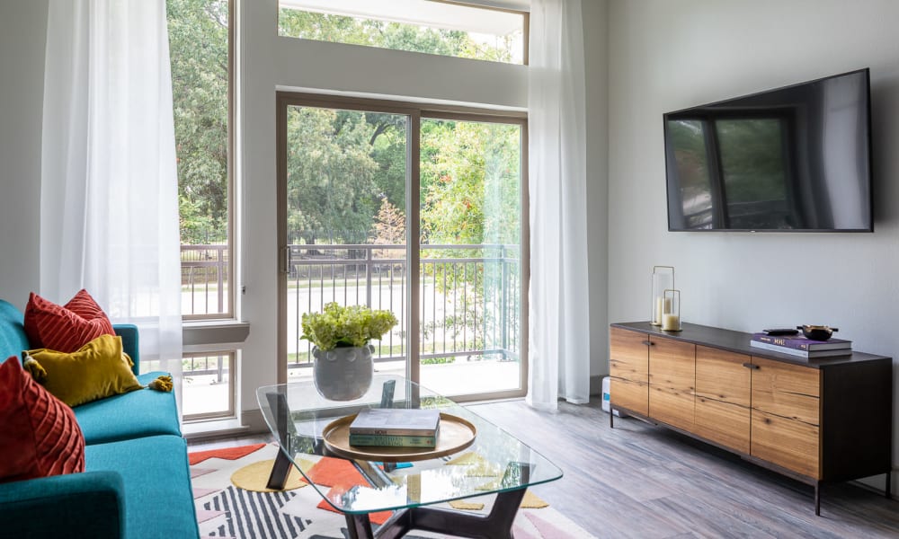 Model living room with private balcony at Bellrock Summer Street in Houston, Texas