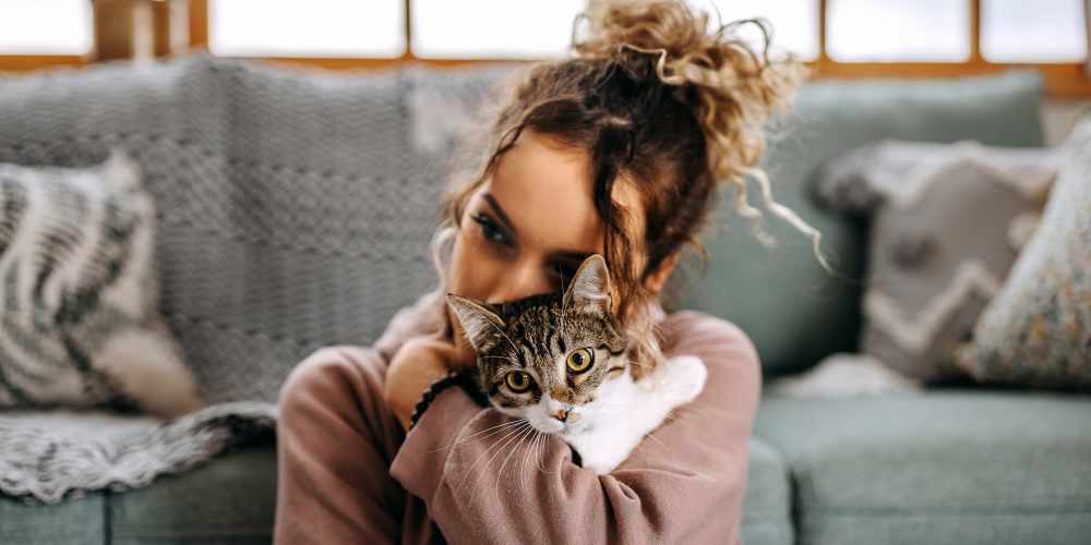 Resident hugging her cat at The Griff in Charlotte, North Carolina