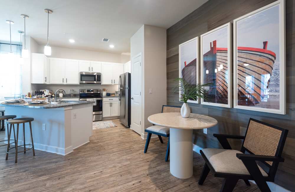Open kitchen with hardwood-style flooring at Mexico Beach Crossings in Mexico Beach, Florida