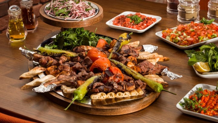 Traditional Turkish kebabs on a wooden table