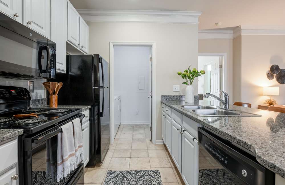 Modern kitchen with breakfast bar at Easton Commons Apartments & Townhomes in Columbus, Ohio