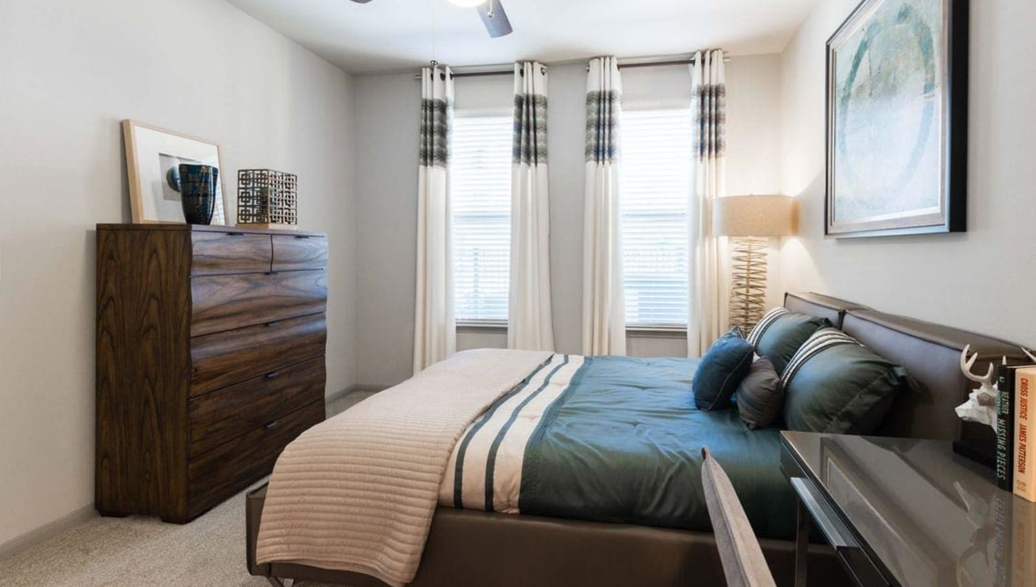 Model bedroom at Olympus at Waterside Estates in Richmond, Texas