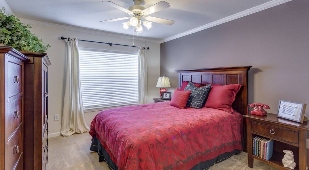 Spacious bedroom with large windows at Verandas at Mitylene in Montgomery, Alabama