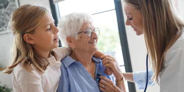 Resident, caregiver and a child at Transitions At Home in Elkhorn, Wisconsin